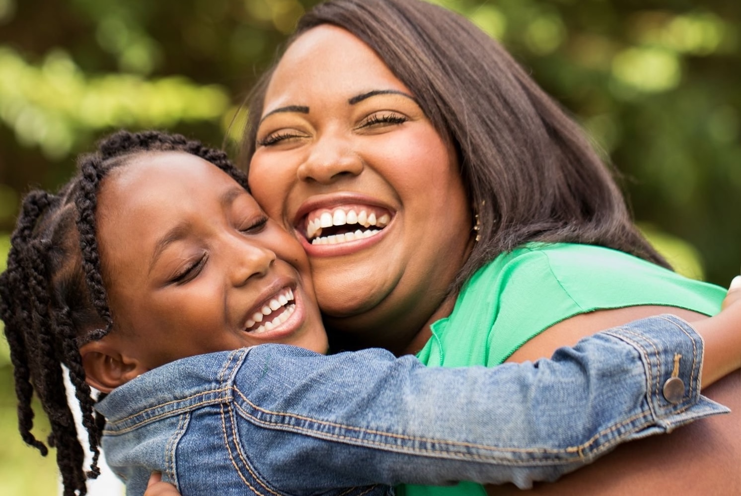 Mother with 8 year old child laughing and hugging